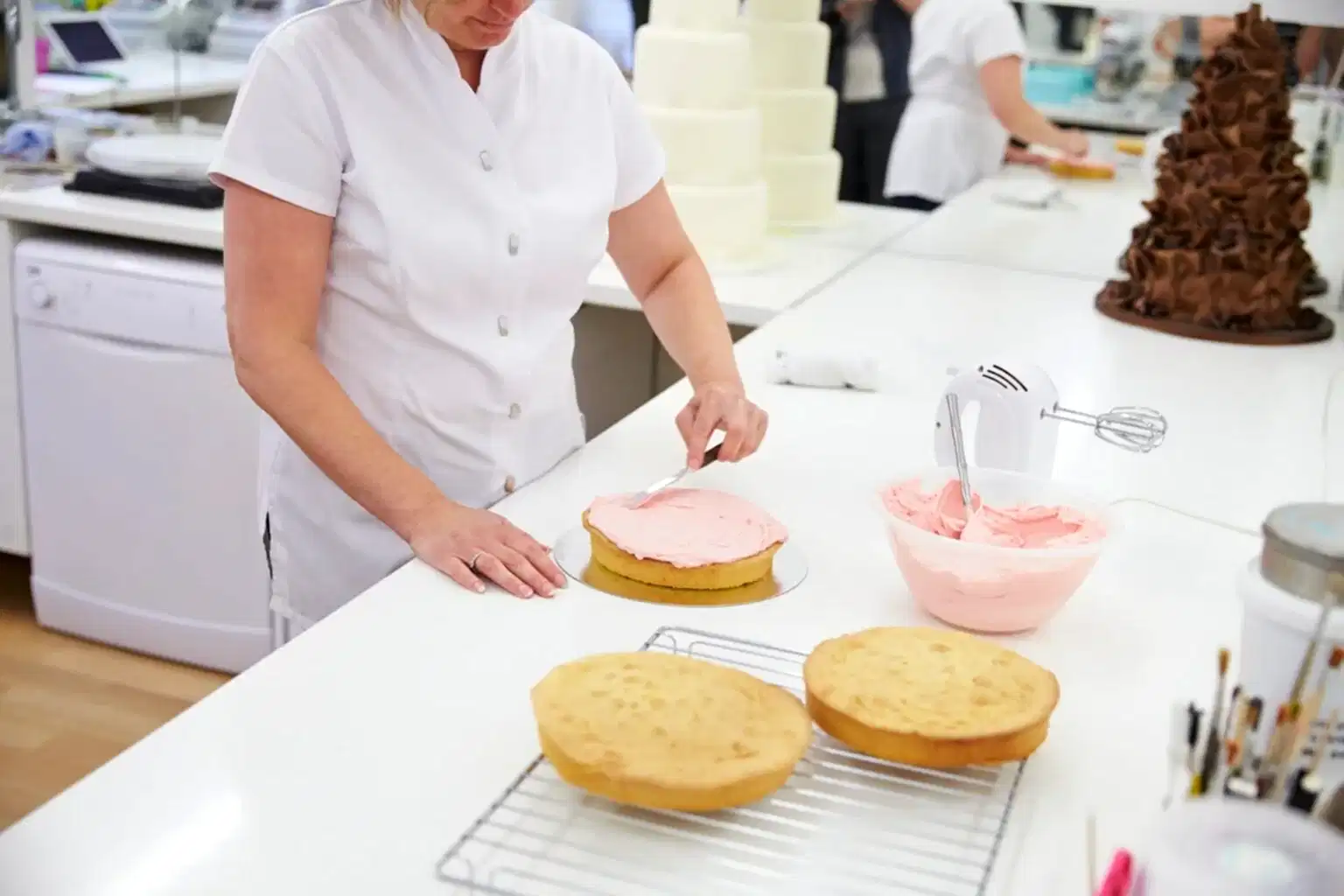 woman-in-bakery-decorating-cake-with-icing.jpg
